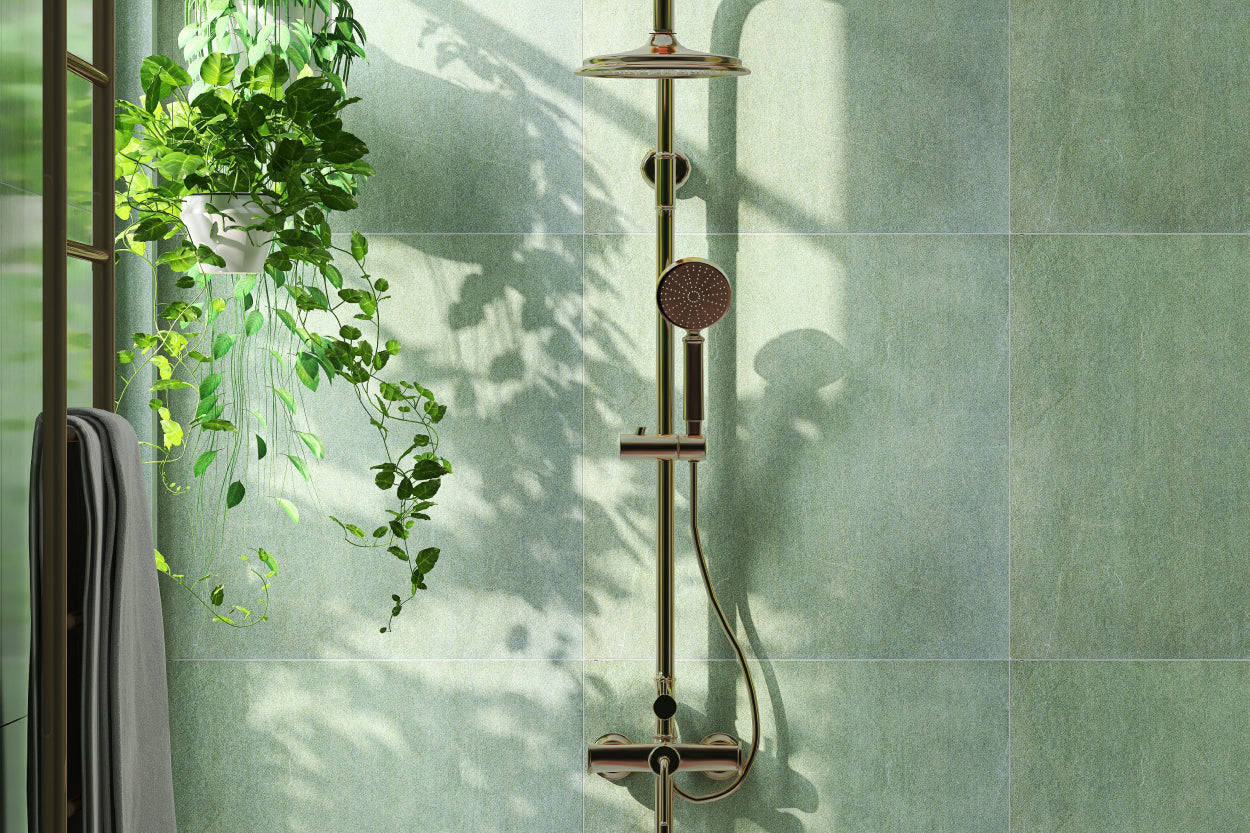 Glass-doored shower with green tile