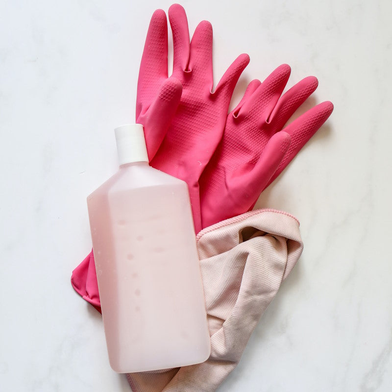 Rubber gloves, bottle of soap, rag