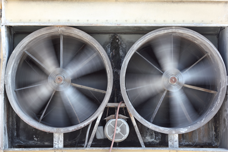 Two large HVAC exhaust fans spinning