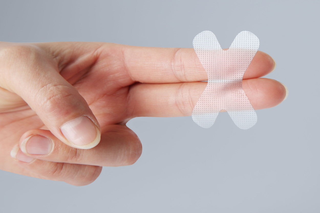 Mouth tape balanced on fingers