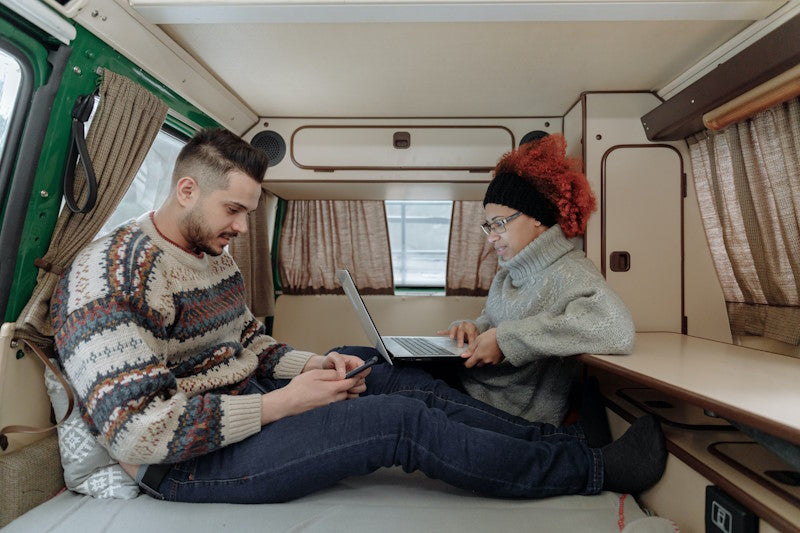 A couple working in an RV