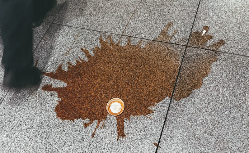 Coffee spilled on a sidewalk