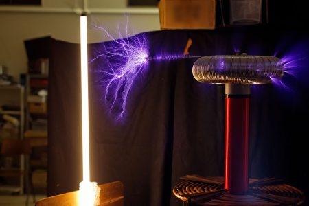 Tesla coil emitting a purple brush discharge
