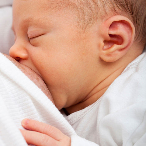 newborn being breastfed