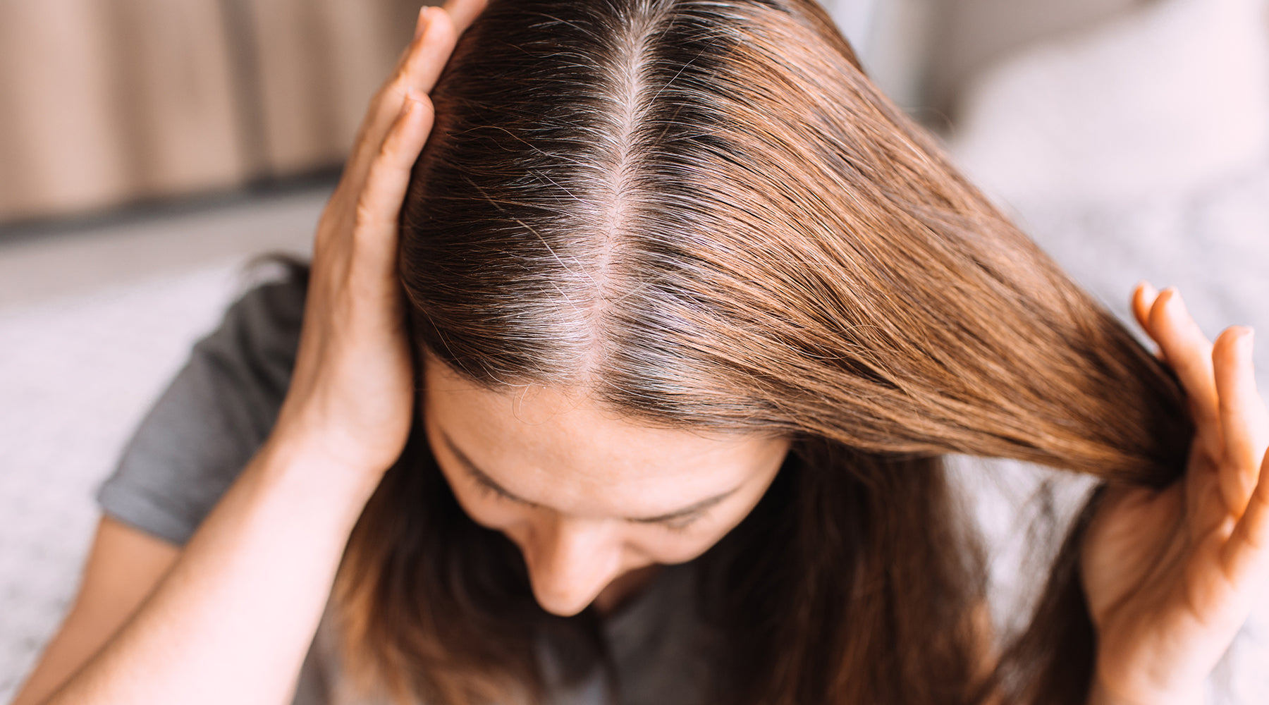 a woman considering henna for grey hair
