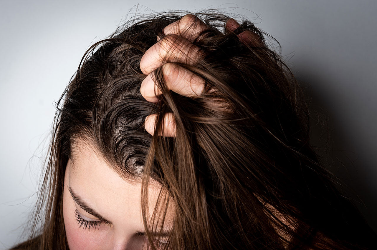 woman needing sensitive scalp treatment