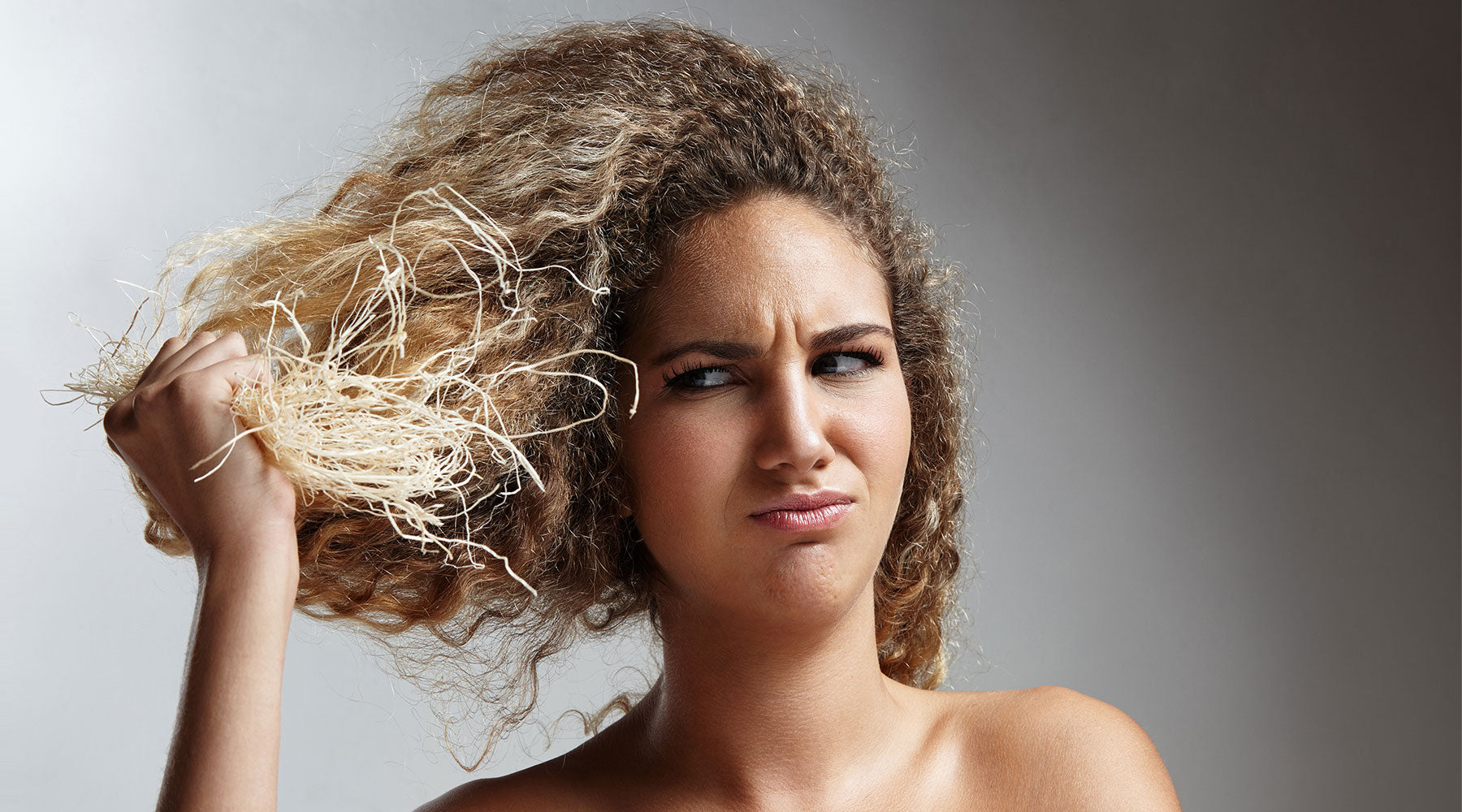 woman with damaged hair thinking what is ppd in hair dye