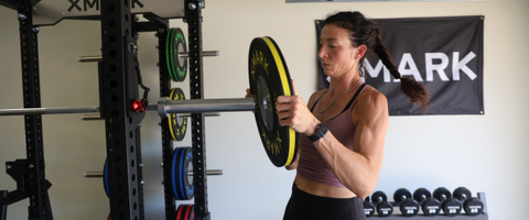 Woman loading a barbell