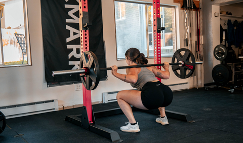 Woman doing barbell squats
