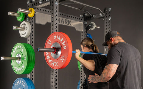 Woman doing back squats with barbell