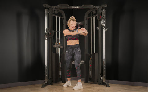 Woman using Functional Trainer for core work