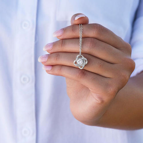 hand holding necklace