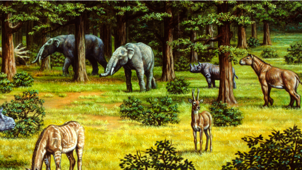 A prehistoric landscape of mastodons, ancient rhinos, and other extinct mammals