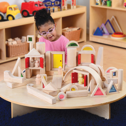 child playing with blocks on a platform
