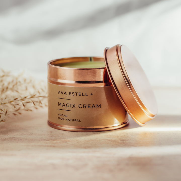 Rose gold container of Ava Estell Magix Cream with lid off.