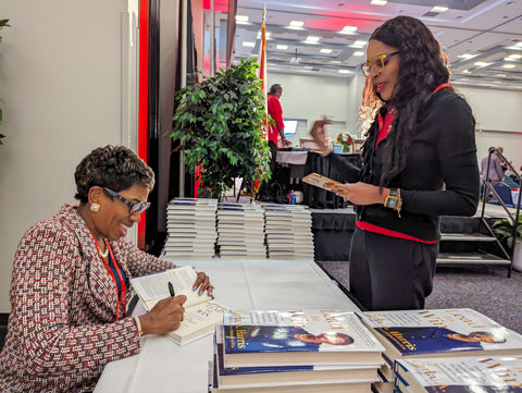 Carla Harris, a Senior Client Advisor for Morgan Stanley, signs her book for Jacksonville-based entrepreneur Angelique Hamilton following her remarks during the inaugural Black Founders Forum on June 15, 2023. | Will Brown, Jacksonville Today