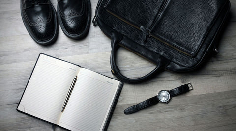black leather shoes with journal, laptop briefcase and watch with black leather watch band