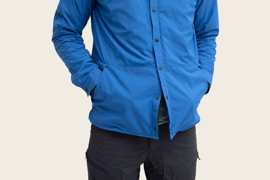 Overshirt with hands in pockets.