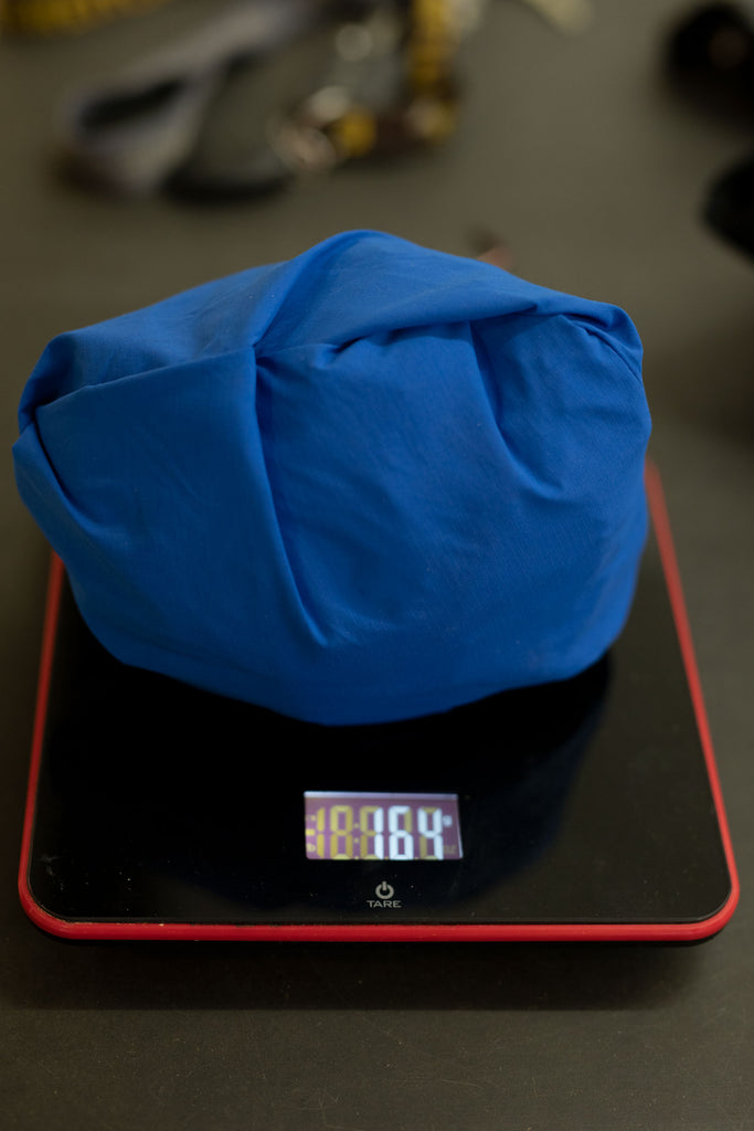 Scale showing weight of shirt.