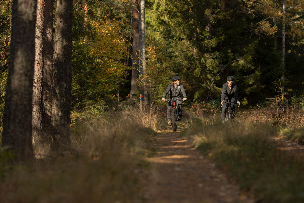 Riding bike in forest.