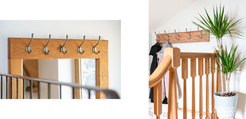 From The Anvil's Pewter Hat & Coat Hooks hung at the top of an oak framed mirror (left) and 5 of the same hooks hung on a rustic wooden plaque with 2 coats hanging off, behind a wooden railing (right).