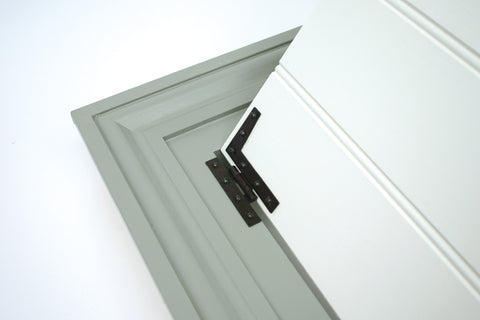 From The Anvil's Beeswax HL hinge on a painted white panelled door