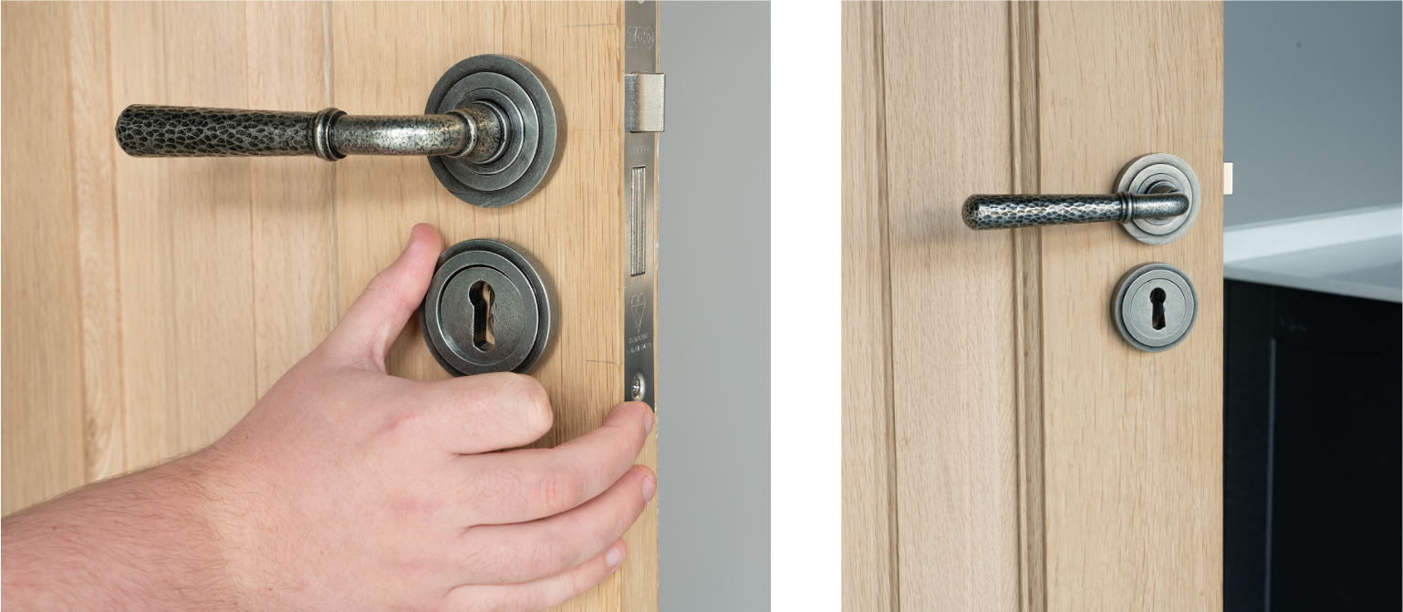 Person tightening a round rose onto a Pewter concealed escutcheon on a wooden door below a Pewter lever on rose door handle.