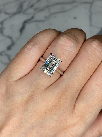 a model wear emerald cut engagement ring