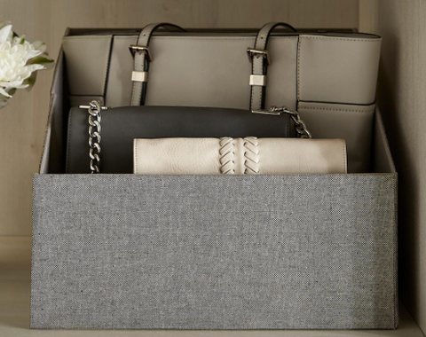 Handbags stored inside box