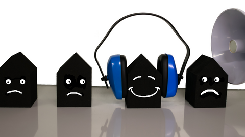 animated unhappy faces reacting to office noise. One face smiling wearing headset