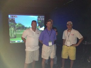 Ace Indoor Golf staff with Event Crew in front of Golf simulator