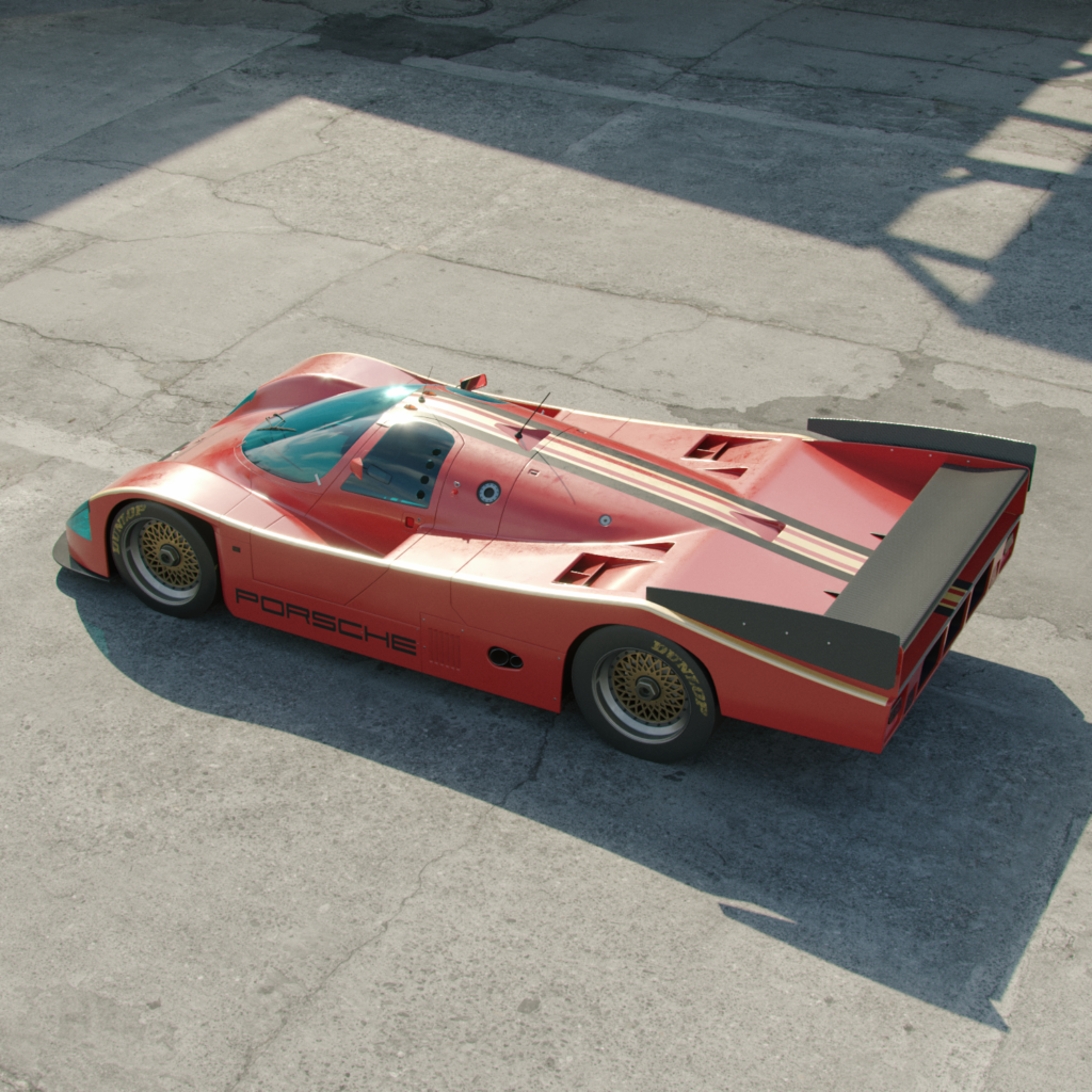 a porsche 962 graphic design car reinvented, appearing in direct sunlight on tarmac.