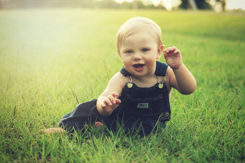 Toddler playing in the grass 