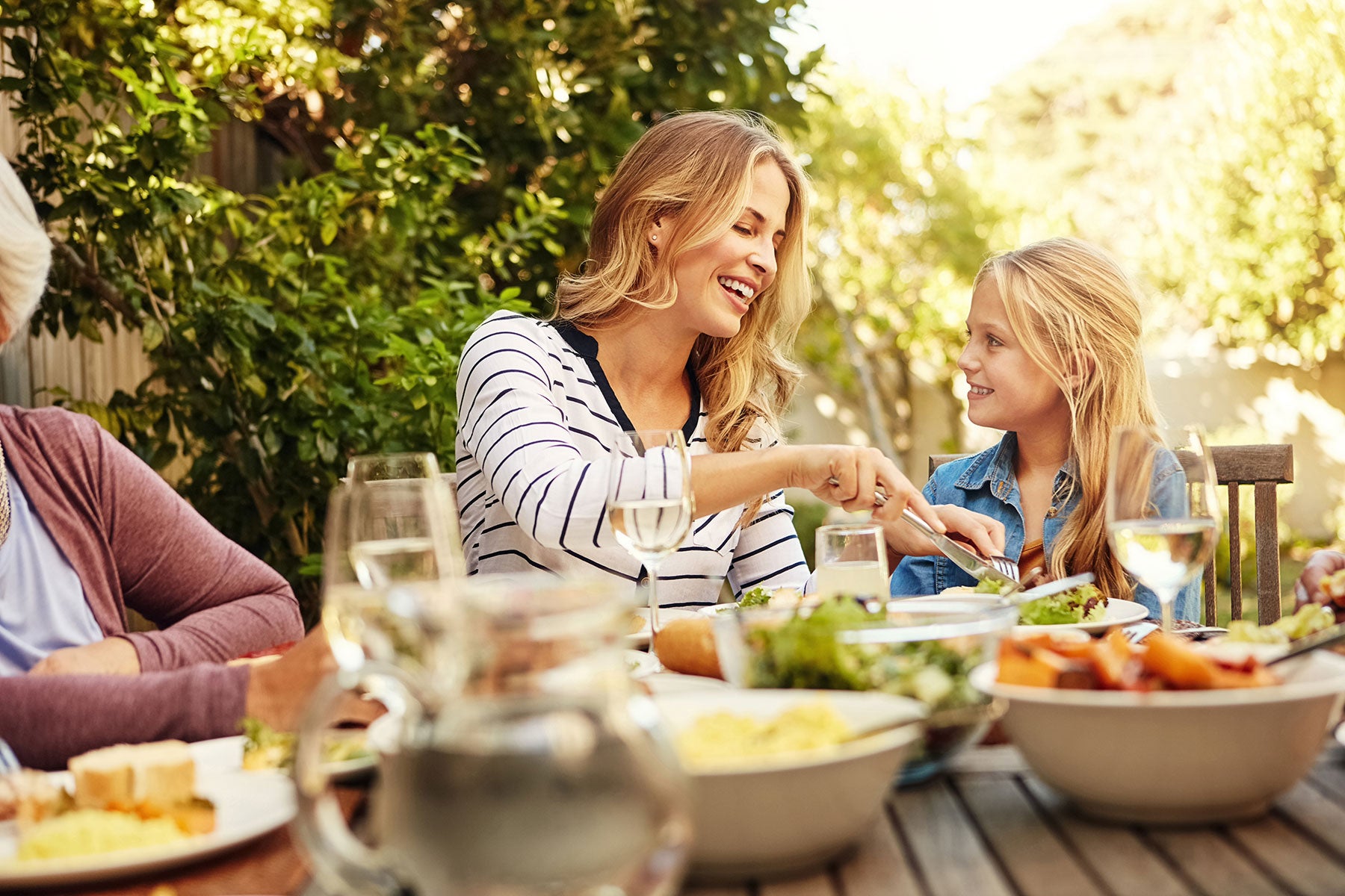 Family dining on the patio in spring