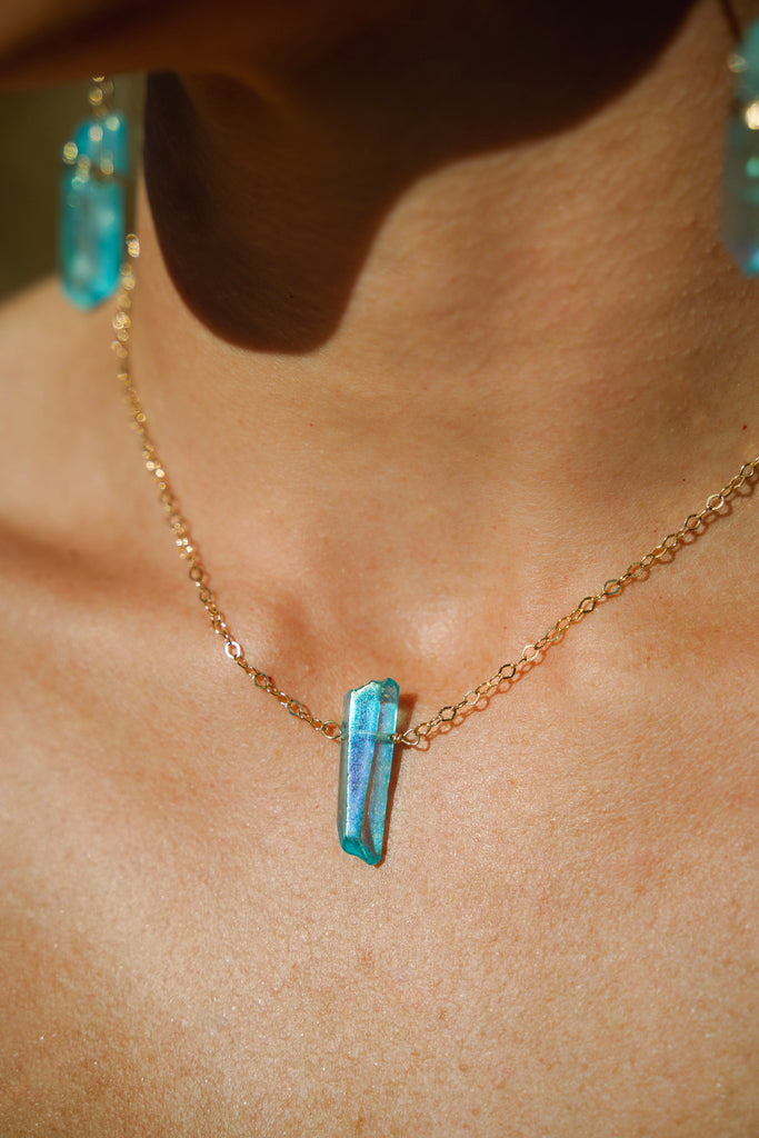 blue angel aura quartz necklace being worn