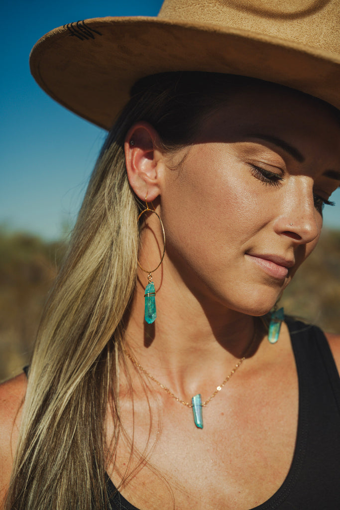 blue angel aura quartz necklace and earrings with tan hat