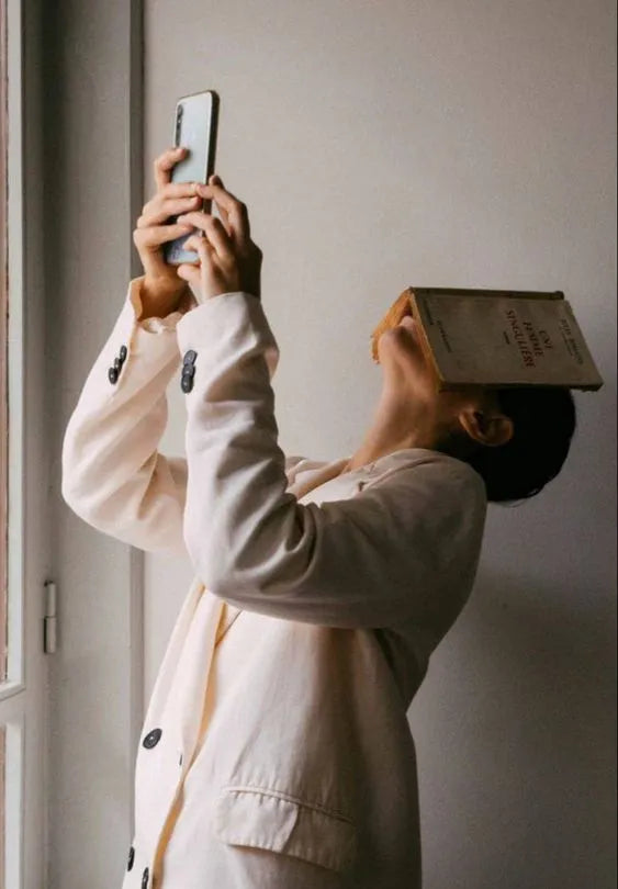Woman with a book on her face