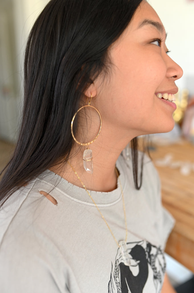 Woman Wearing Quartz Hoop Earrings
