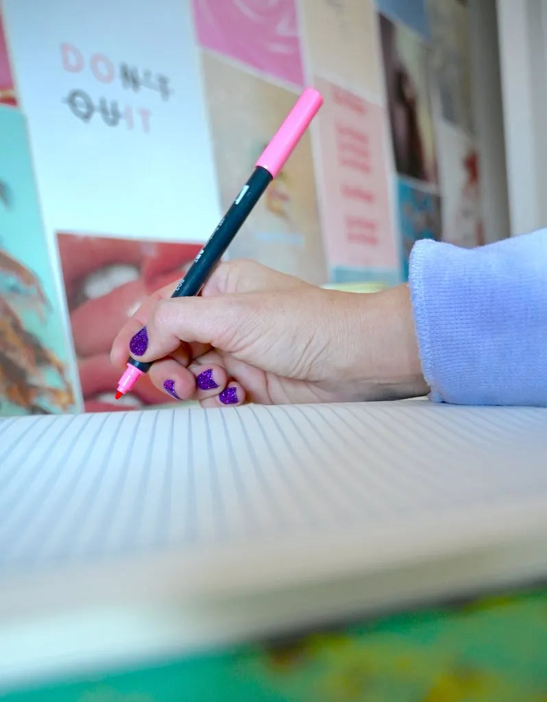 Woman Writing in Notebook
