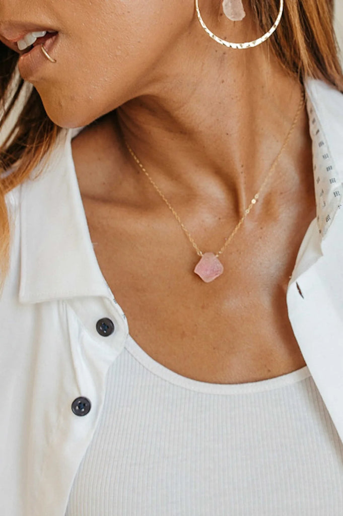 woman wearing a raw rose quartz crystal on a 1.5mm 14k gold fill cable chain