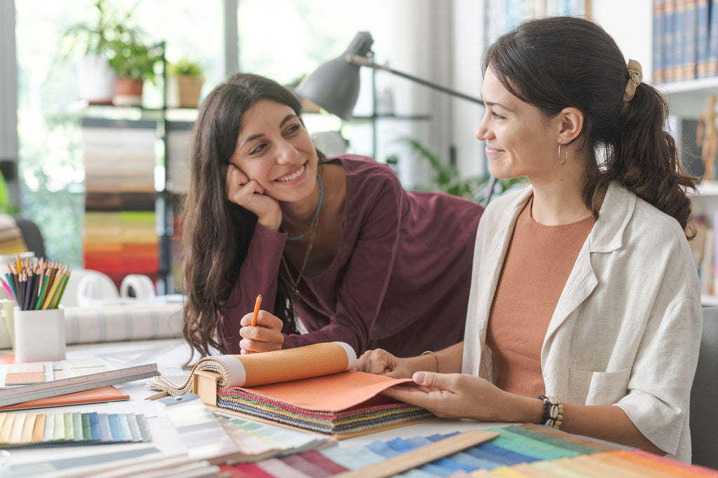 a woman talking with her colleague