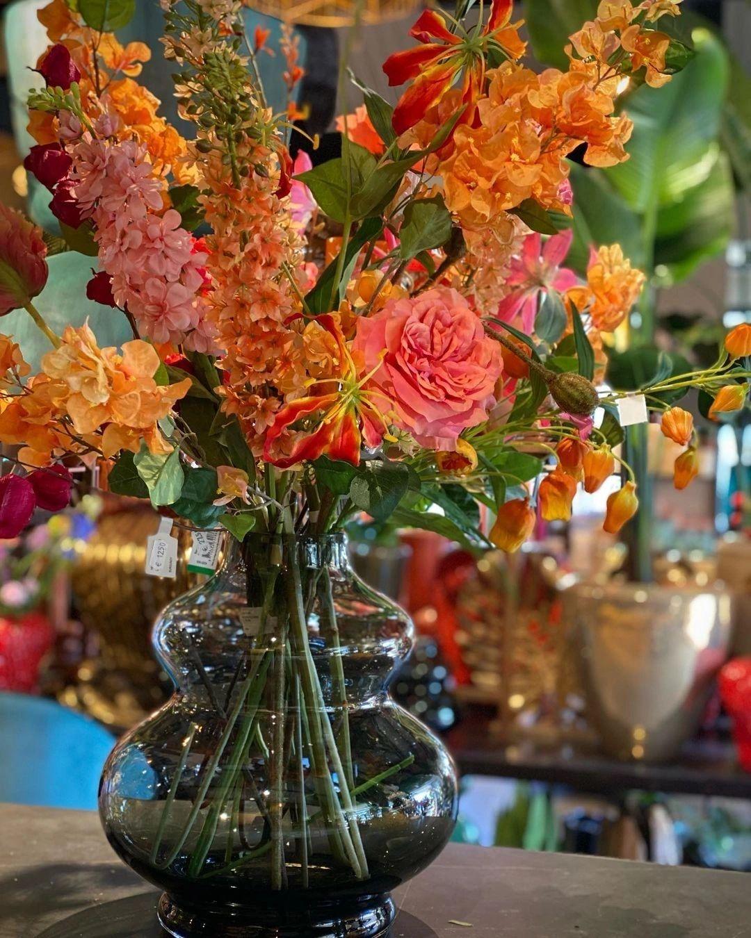 Happiness in a vase. Real or silk flowers, they provide bright colours in any home