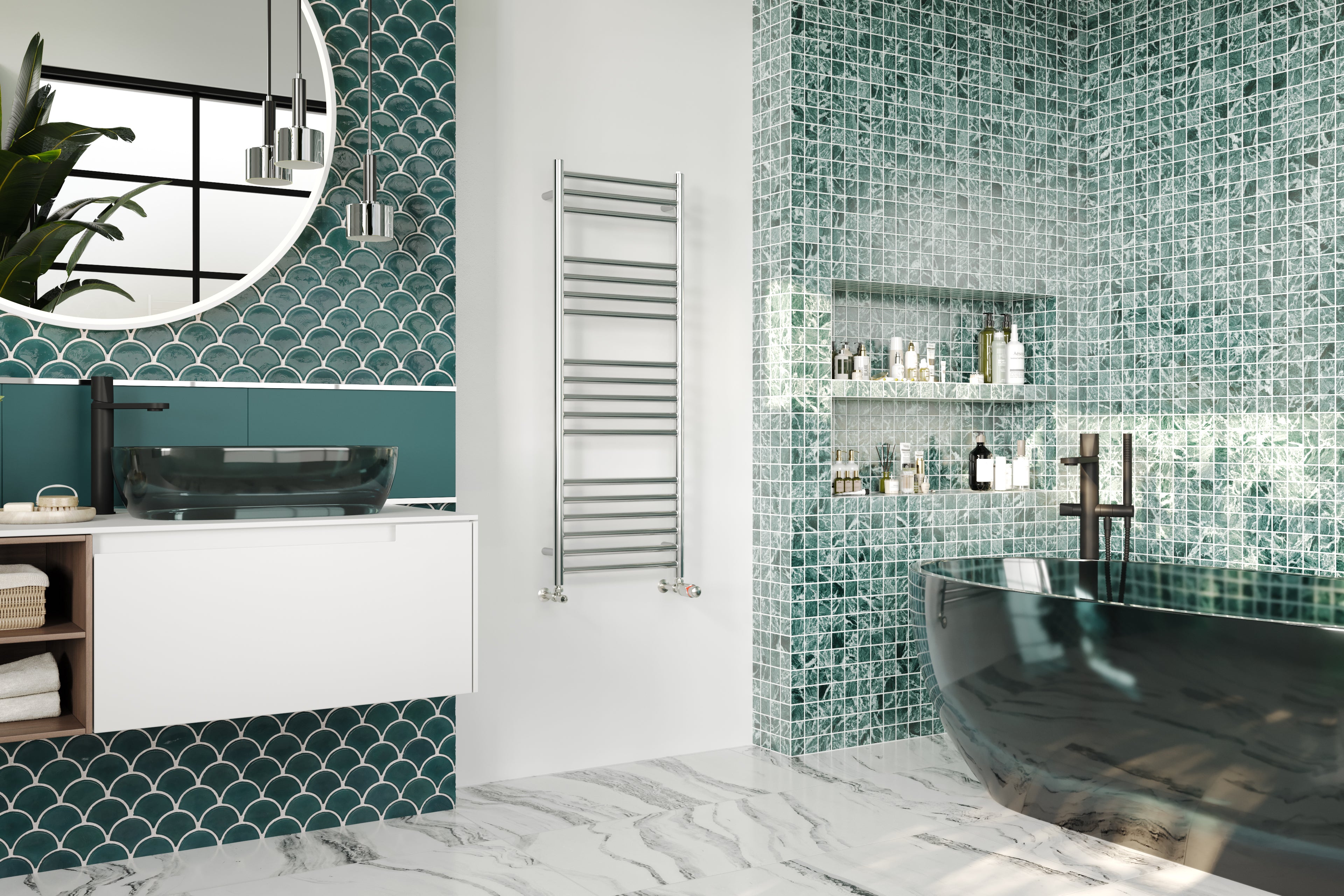 An Aston stainless steel heated towel rail is mounted to a white wall between a green tiled area with a bathtub and a turquoise wall with a sink space.