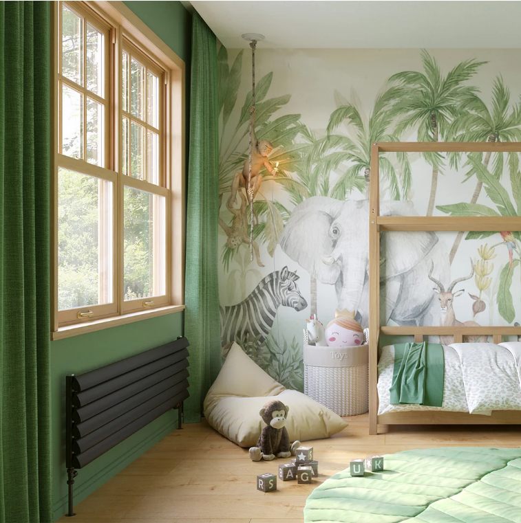 An image of a grey radiator installed underneath a window in a nursery room