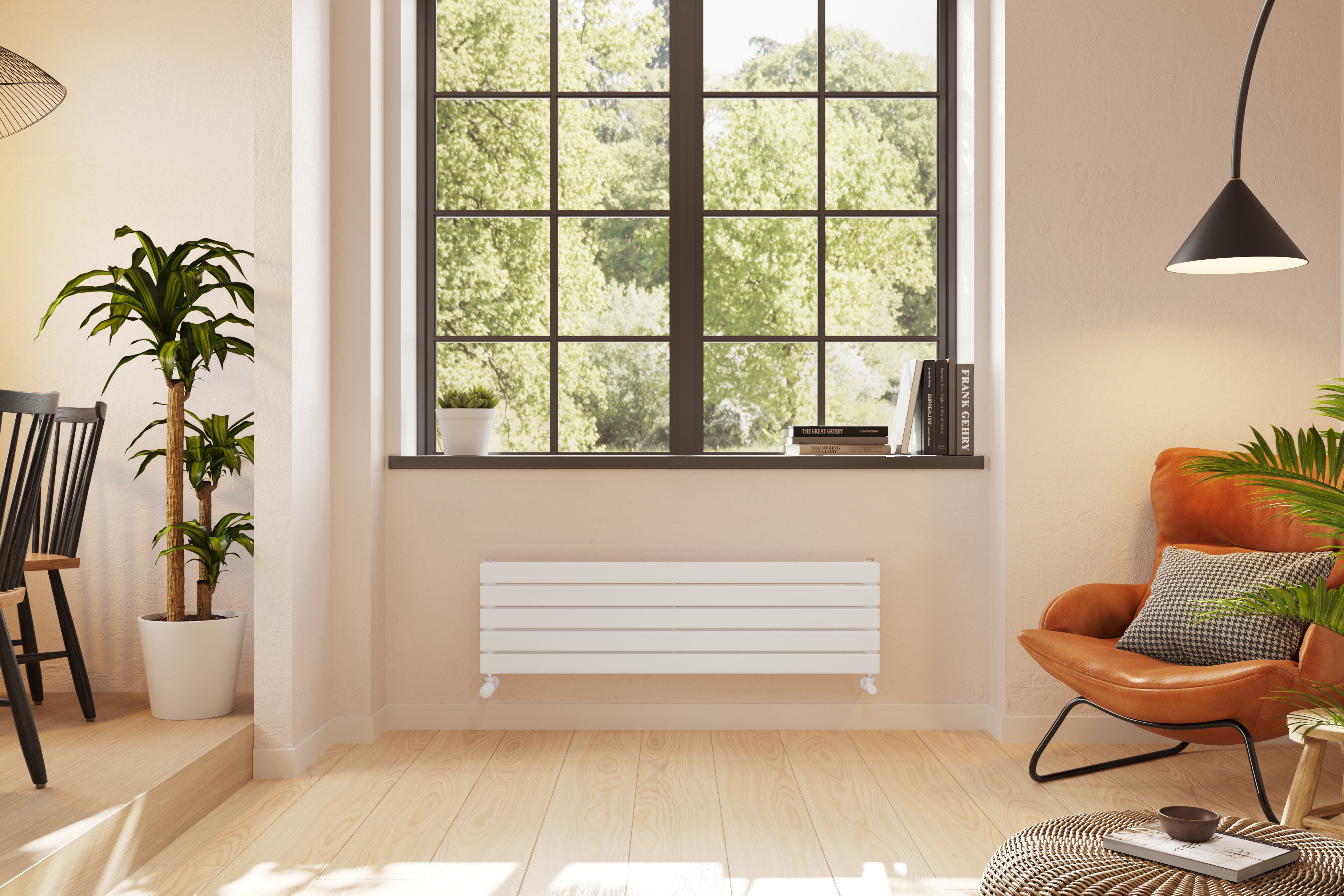 A matt white, horizontal, 2-panel radiator on a soft pink wall in a Scandi-inspired living room, beneath a window. Plants and trendy furniture.