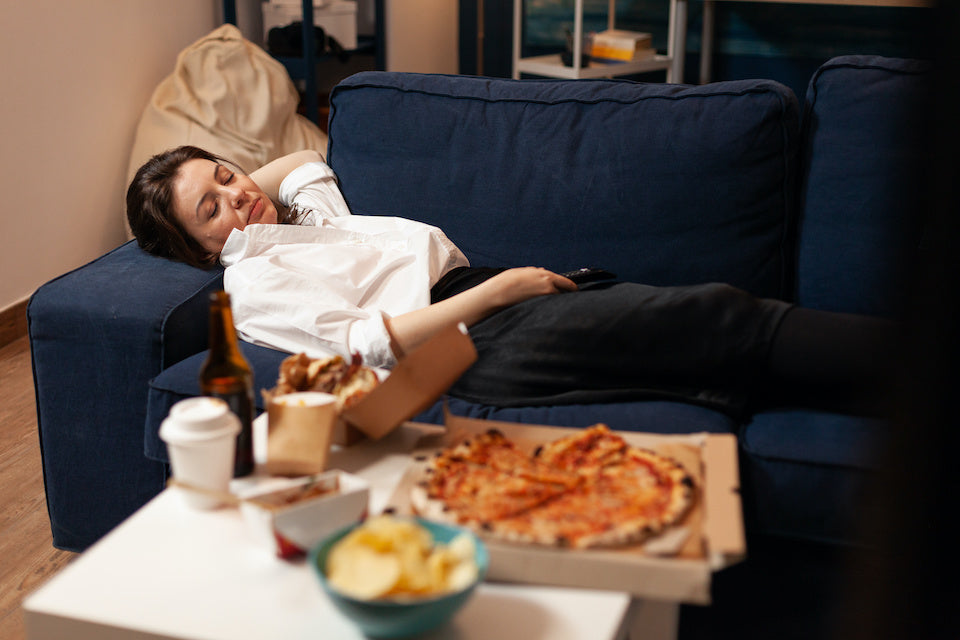 Tired woman with junk food