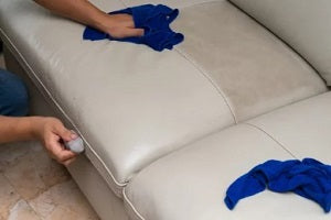 cleaning leather sofa with soft cloth