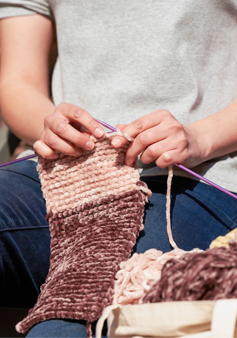 image of women knitting blanket