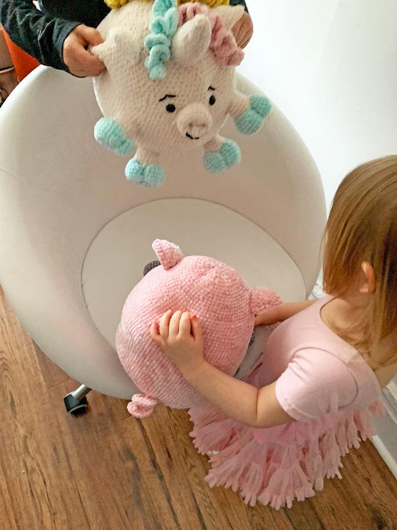 Kids playing with crochet toys