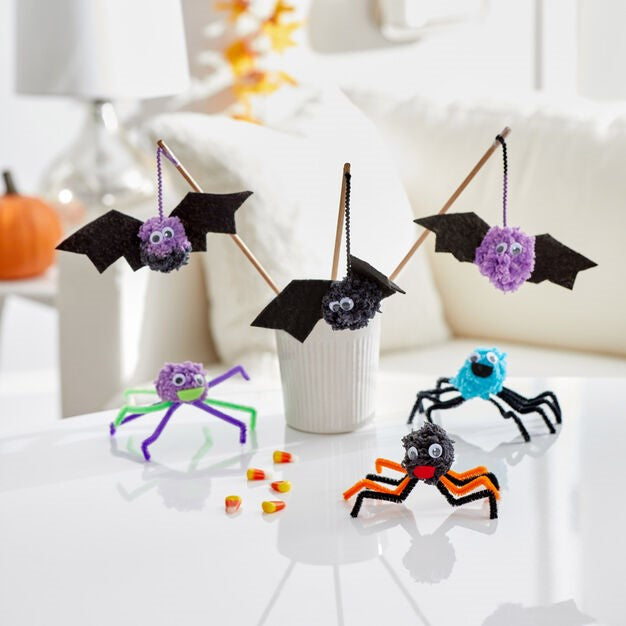 Three Pompom monster and three pompom bats are placed on the table